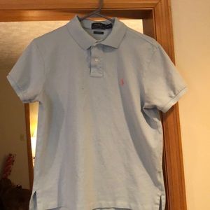 Teal polo with pink polo symbol